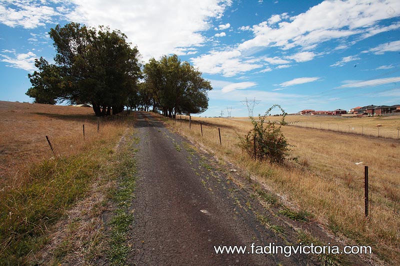 Entrance road to the base. Mcmansions from Roxburgh Park visible to the east.