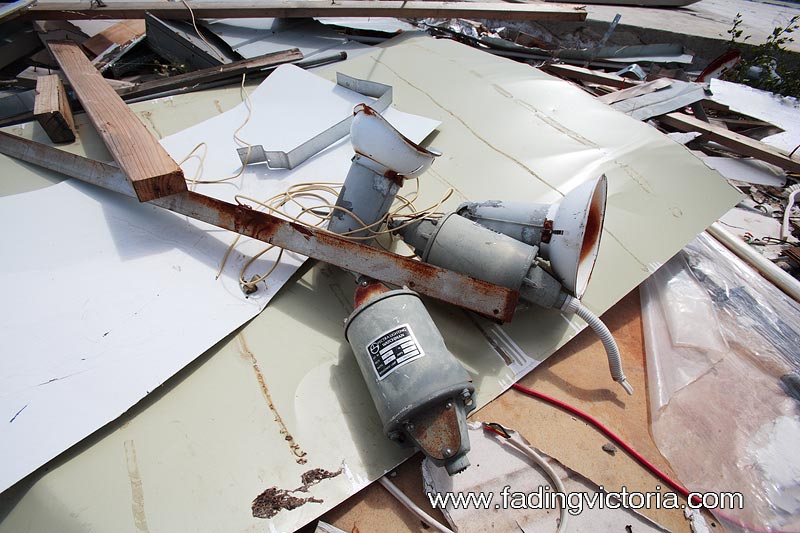 Remains of building in the admin area, including light fittings.