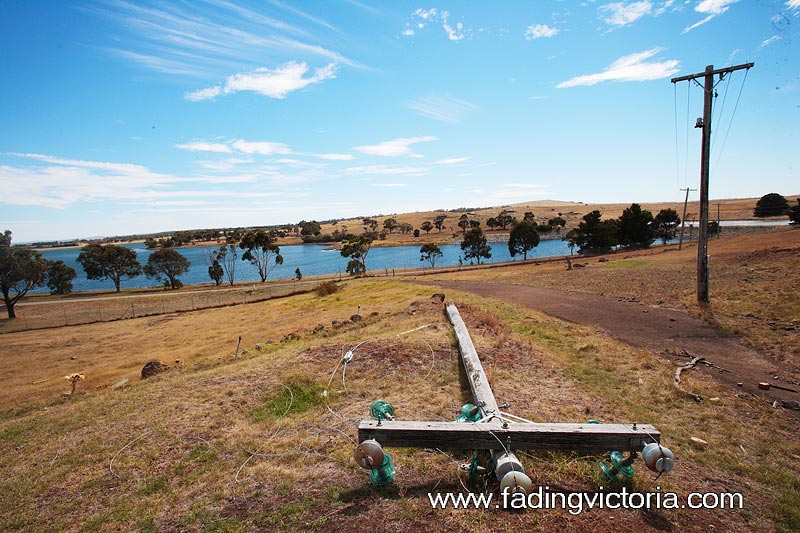 Downed power pole. View of the Greenvale Reservoir.