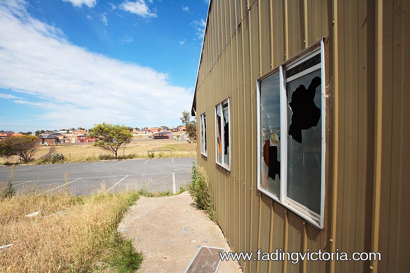 Broken windows in the admin area. Houses from Roxburgh Park visible.