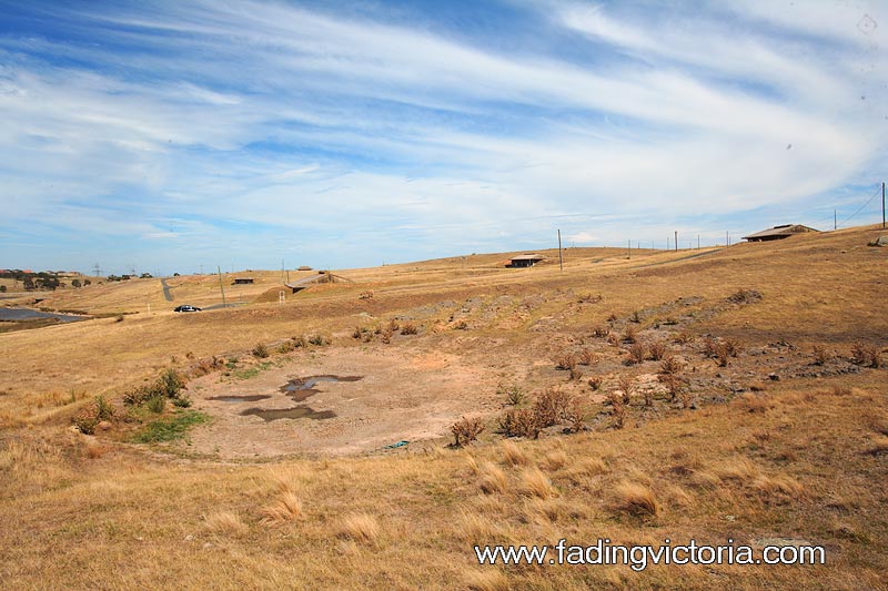 Parched remains of a dam. There are several on site.