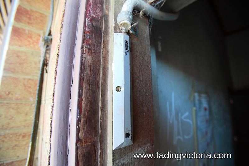 This is either some type of magnetic lock, or a reed switch to detect that the door has been opened.