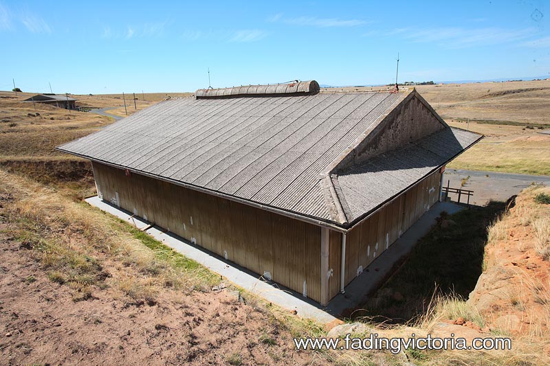Rear view of warehouse showing the roofing, and lighting arrestor spikes.